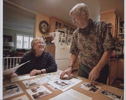 Phyllis Rogers Sharrow and Lauren Bettinelli with family photographs, Petaluma, California, 2009