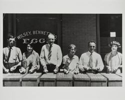 Men and women displaying Wilsey, Bennett Company eggs