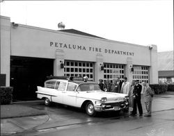 Examining the new Petaluma Fire Department ambulance, Petaluma, California, about 1958