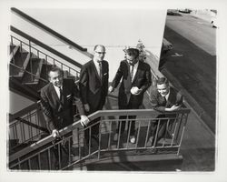 Four men on the steps of the parking garage at 3rd and D St., Santa Rosa , California, 1964