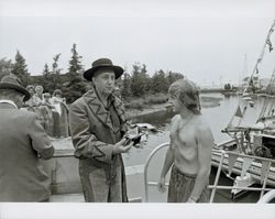 Fred Schram as a Spanish explorer accepting the Bear Flag from a costumed sailor at the opening ceremonies of the Combined Old Adobe Fiesta and Petaluma River Festival of 1986