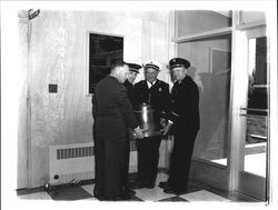 Members of the fire department with a bell, Petaluma, California, 1955