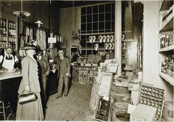 Unidentified people standing inside C. Gervasoni & Sons delicatessen, Petaluma, California, about 1914