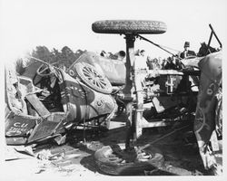 Large pile of wrecked racing cars