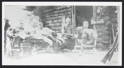 Men on the porch at "the roughs" deer hunting lodge, Cazadero