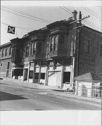 Abandoned buildings on the north side of Washington Street just west of the bridge, Petaluma, California, 1960