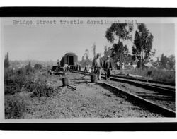 Railroad engine in Petaluma River at Bridge/Hopper Street trestle, Petaluma, California, 1941