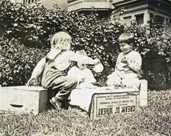 Wilfred Everett Bixby, Jr. having a tea party with two other unidentified children at the Bixby house, 415 Perkins Street, Oakland, California, about 1912