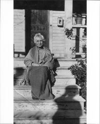 Julia Mock Neil sitting on the steps of her home at 231 Wilson Street, Petaluma, California, about 1920