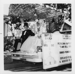 Lorris I. and Ilah M. Dillingham riding on a float in the Centennial Parade, Petaluma, California, July 4, 1976