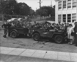 Students from St. Vincent's School posing with a jeep and machine gun, Petaluma, California, 1942