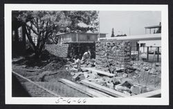 Bricklayers building the courtyard wall