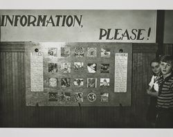 Children standing near Information Please display at the Petaluma Carnegie Library, 20 Fourth Street, Petaluma, California, 1940