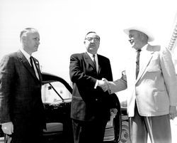 Governor Edmund Brown shaking hands with polical activist John Watson