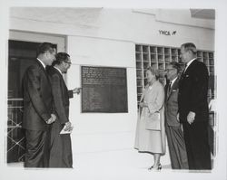 Group looking at plaque on YMCA building, Santa Rosa, California, 1964