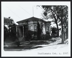 One story Italianate cottage with hip roof and bracketed cornice