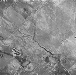 Aerial view of Denverton Creek and California Highway 12 (Rio Vista Road), Oct. 28, 1963