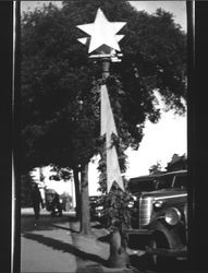 Christmas star decorating a light pole, Petaluma, California, about 1932