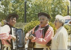 Helen Putnam with strolling musicians at County Fair Board luncheon, Santa Rosa, California, 1979