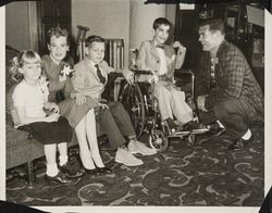 Sport figures with crippled children who participated in the charitable events of the Red Coat Organization, Santa Rosa, California, 1960