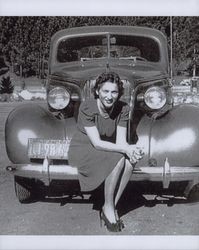 Evelyn Ransom seated on the bumper of her car, Petaluma, California, 1939