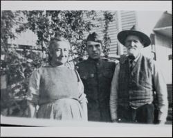 Maria Ignacia Valenzuela Burghard, her husband Gustavus Burghard and son-in-law George L. Stone, son-in-law, at the Burghard home at 826 South Davis Street, Santa Rosa, California, between 1917 and 1918