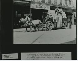 Men with a loaded wagon outside Dodge Sweeney & Company