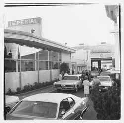 New cars and attendees at the Zumwalt Chrysler-Plymouth Center Open House outside the showroom, Santa Rosa, California, 1971