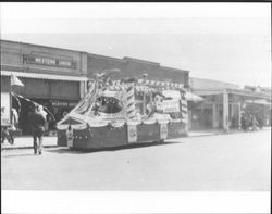 Unidentified poultry foods float, Petaluma, California, about 1923