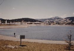 Looking across swimming area to boats sailing on Spring Lake