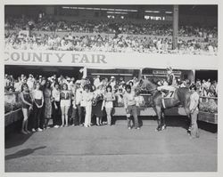 Winning horse and jockey with fans in the Winner's Circle at the Sonoma County Fair Racetrack, Santa Rosa, California