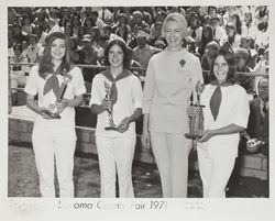 4H exhibitors show trophies won at goat exhibit at the Sonoma County Fair, Santa Rosa, California, 1971