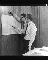 Richard B. Codding and Bill Smith looking at plans of Coddingland Shopping Center, Santa Rosa, California, May 26, 1971