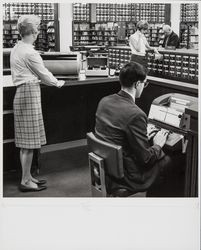 Library staff at work on the reference desk