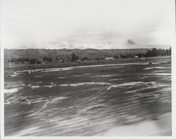 Flooded construction area between Petaluma Boulevard North and Highway 101 in southern Sonoma County, 1950s or 1960s