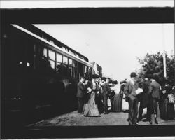 Crowd boarding a Petaluma and Santa Rosa Railroad car, Petaluma, California, about 1910