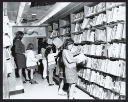 Children browsing the bookmobile shelves