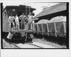 Men standing on the platform of a caboose, Santa Rosa, California, 1935