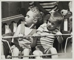 Young children enjoy carnival ride at the Sonoma County Fair, Santa Rosa, California