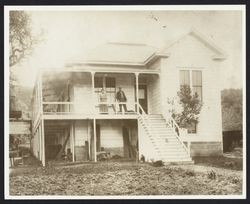 Early Geyserville residents standing on their porch