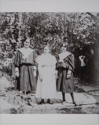 Unidentified female members of the Judge Stephen Akers family sit in the garden of the Judge's home, about 1900