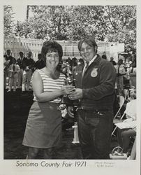 Charles Cunningham receives FFA Trophy presentation at the Sonoma County Fair, Santa Rosa, California, 1971