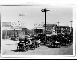 Horses and wagons parked near the George P. McNear Company building, Petaluma, California, 1900