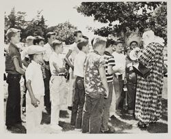 Timbo the Clown hands out balloons at the Sonoma County Fair, Santa Rosa, California, 1957