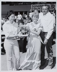 Dairy Princess Carmen Guillett accepts award at the Sonoma County Fair, Santa Rosa, California, about 1974