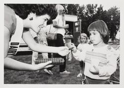 Dairy Princess hands out cookies at the Sonoma County Fair, Santa Rosa, California, 1984