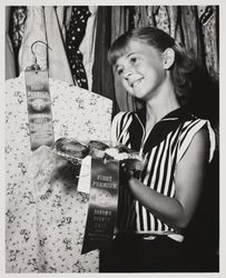 Linda Swenson blue ribbon winner in the junior home economics exhibit at the Sonoma County Fair, Santa Rosa, California, 1958