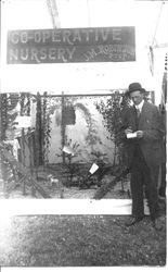 Gravenstein Apple Show display of Co-Operative Nursery, J.M. Robinson, Proprietor on sign, about 1920