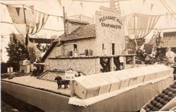 1910 Gravenstein Apple Show display of Pleasant Hill Evaporator building in whole and dried apples