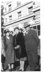 Charles R. and Eva Myers standing with and unidentified woman outside a large building in January, 1947